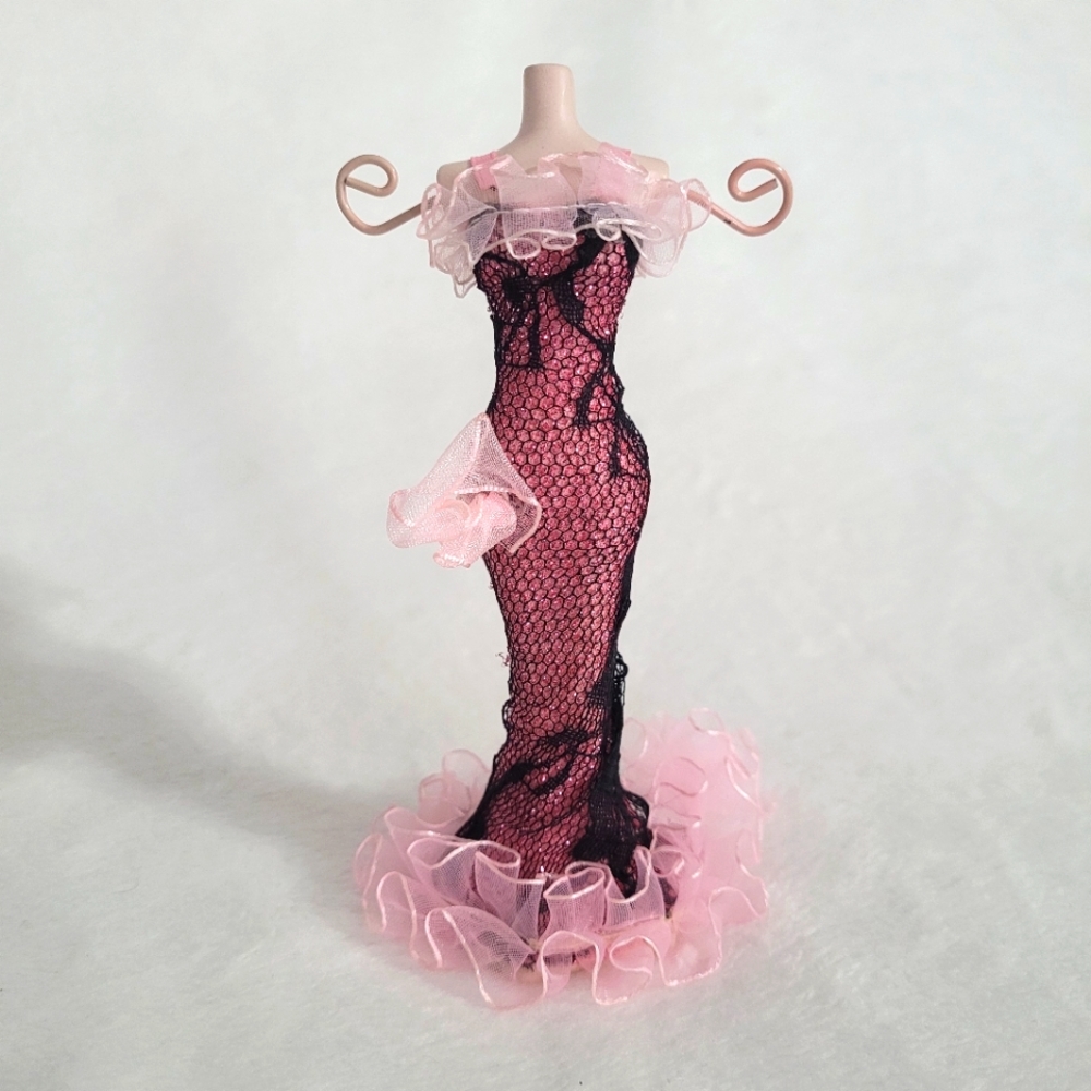 Jewelry stand/holder porcelain manican with detailed dress. Two prongs.